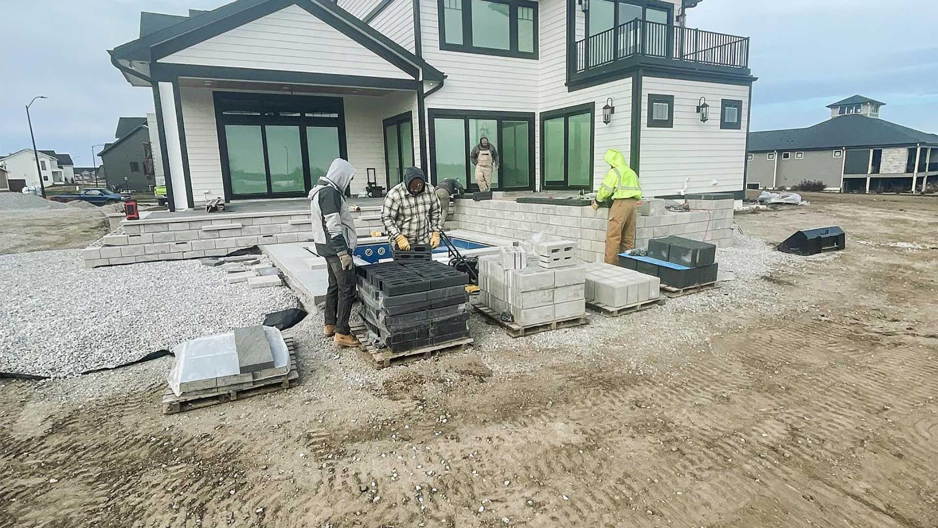 Ankeny Lawn & Landscapes crew constructing a patio in Ankeny, IA.