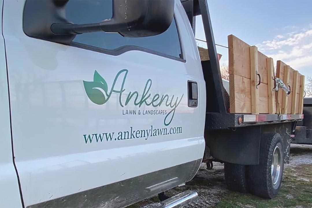 Ankeny Lawn & Landscapes work truck at a property in Ankeny, IA.